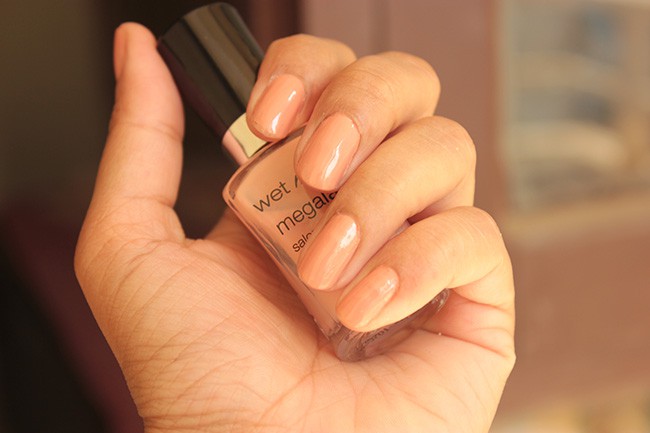 Nude wet n wild nail polish in the color Private Viewing also gold
